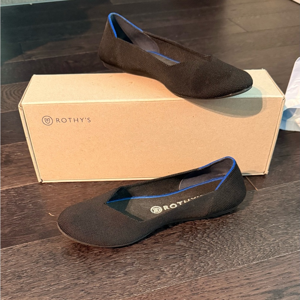 Rothy's Black Slip-Ons with Blue Accent